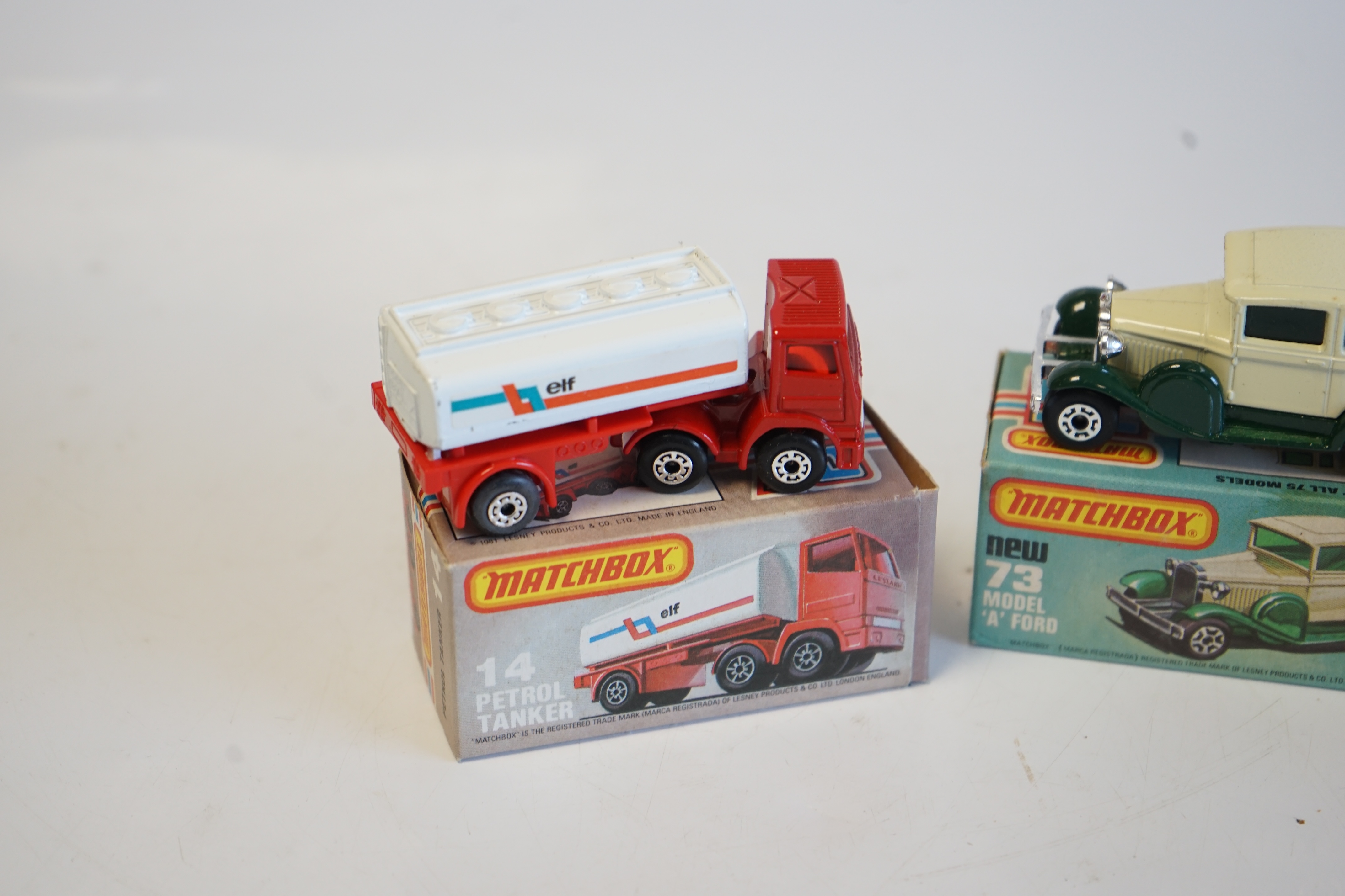 Seventeen boxed Matchbox Series 1-75 diecast vehicles including; 1; Dodge Challenger, 9; Ford RS 2000, 10; Plymouth Police Car and another, 11; Car Transporter, 14; Petrol Tanker and another, 28; Formula Racing Car, 32;